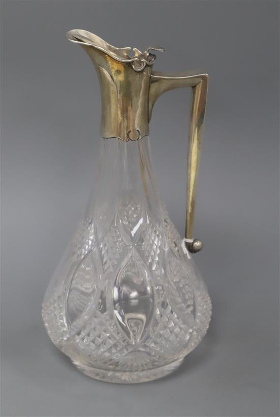 An Edwardian silver mounted cut glass claret jug, by John Grinsell & Sons, London, 1905, height 25cm.